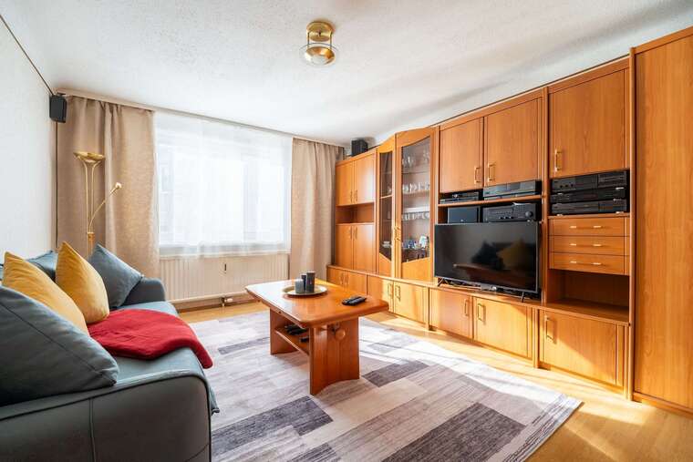 Cozy Living Room with Plush Seating & Smart Entertainment - Ideal for Evenings In or Movie Nights