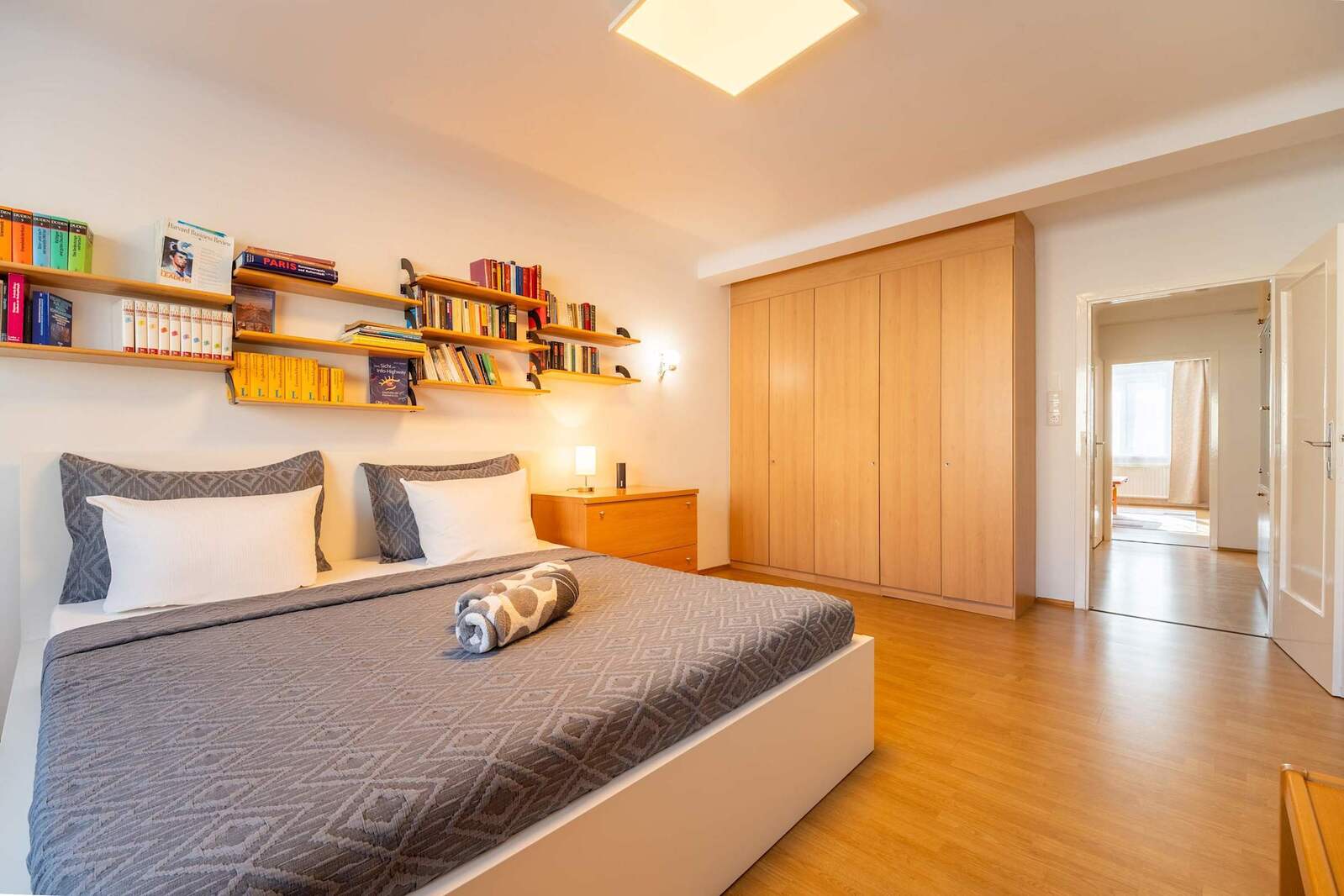 
Master Bedroom Alternate Angle - Built-In Storage and Book Collection Add Warmth & Functionality
