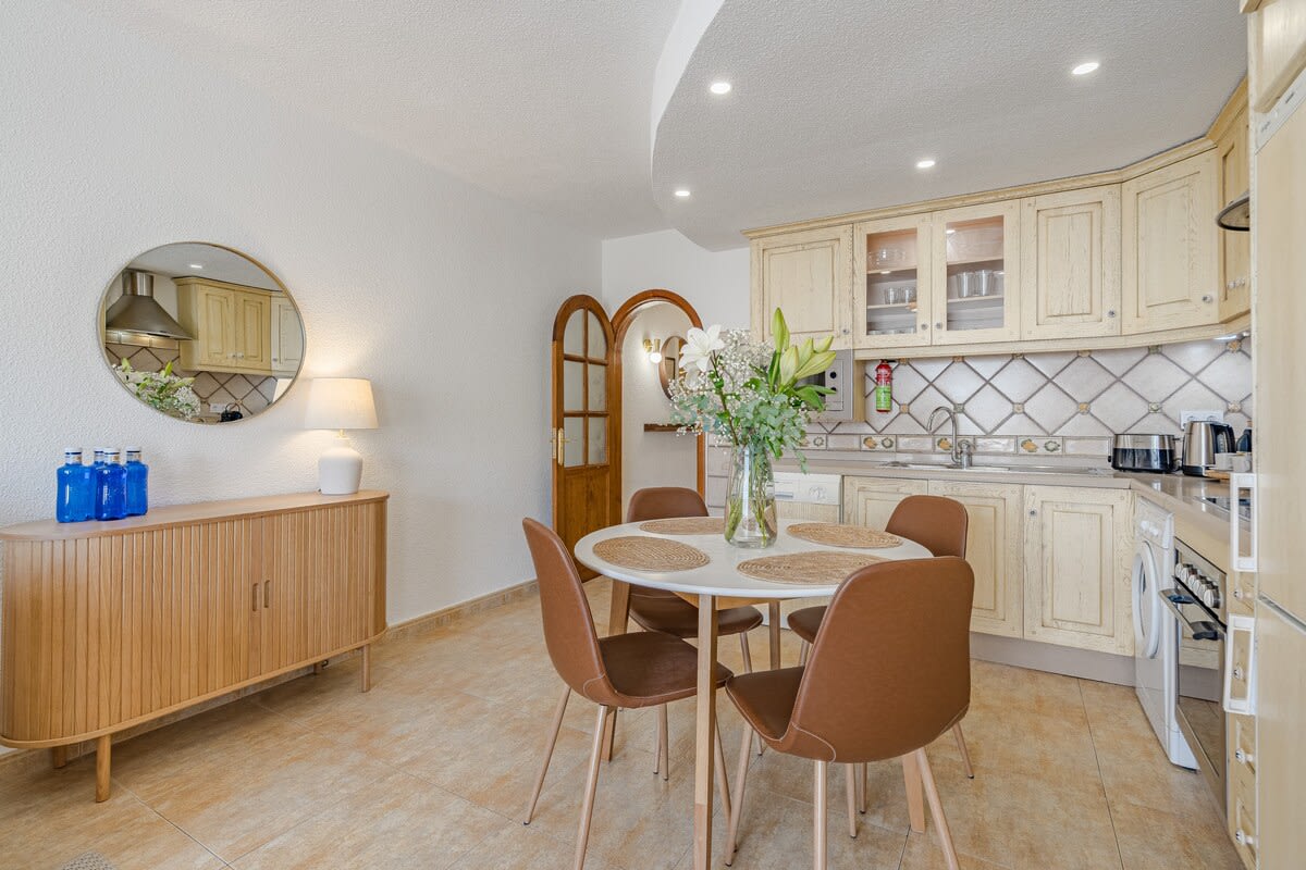 Fully Equipped Kitchen with All Appliances & Dining Area