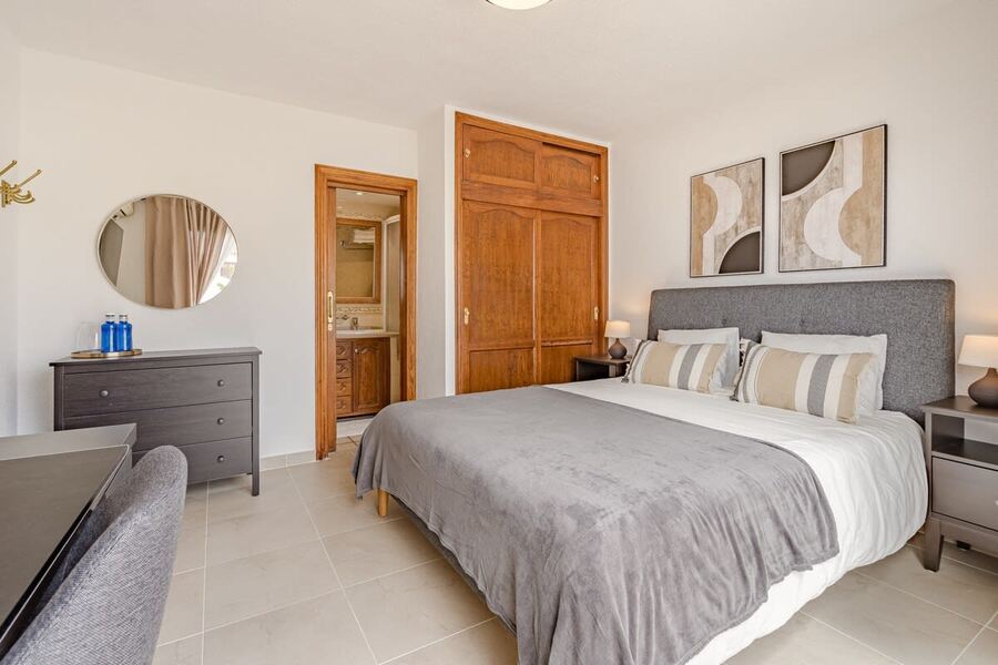 Master Bedroom with Queen-size Bed, TV, Wardrobe, Desk & AC