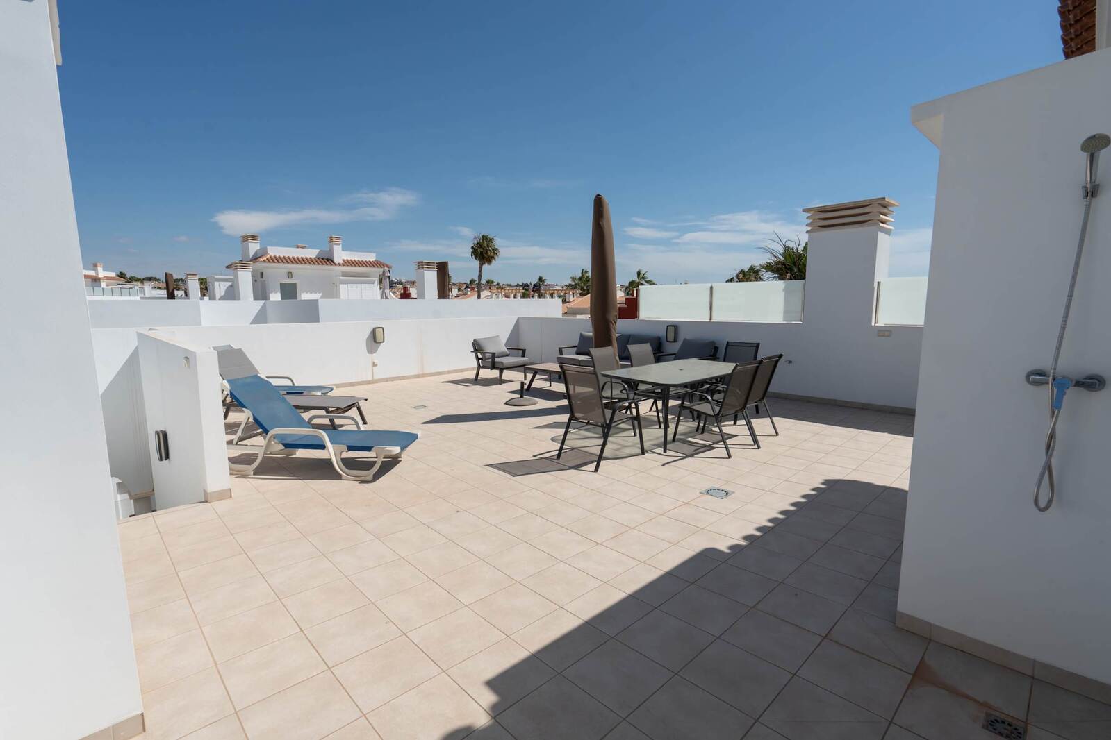 Terrace with Dining table, Sun loungers and Sun Umbrella
