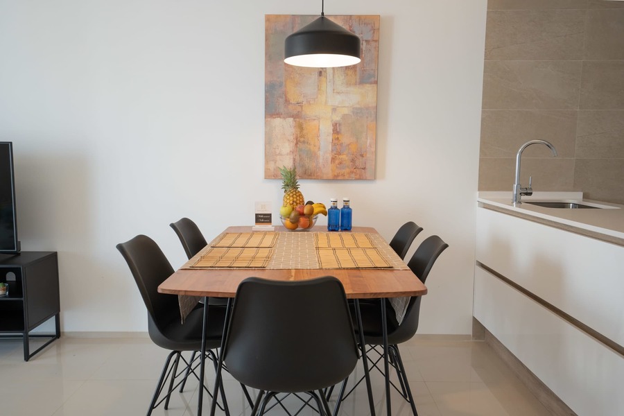 Kitchen with Dining Table, Oven, Stovetop, Microwave, Dishwasher, Fridge and Toaster