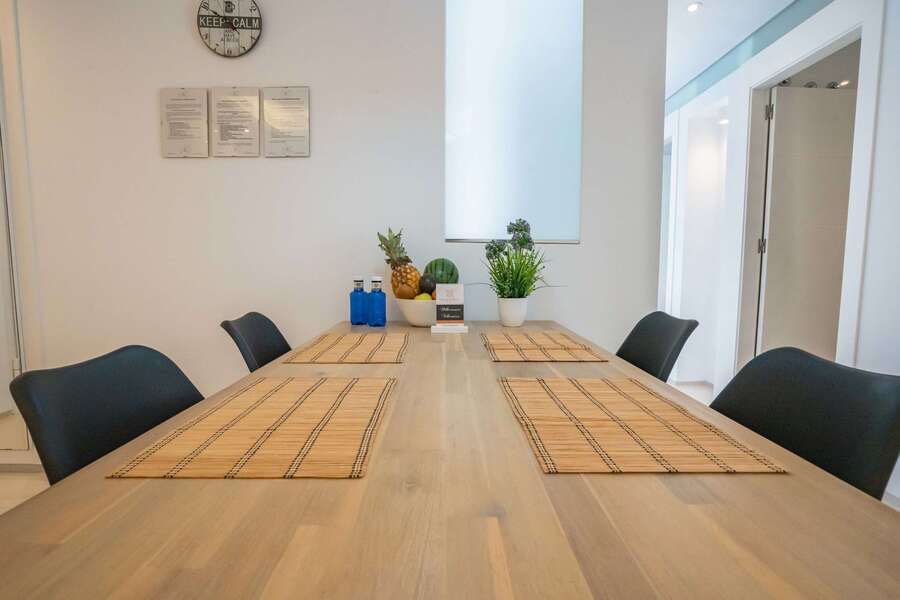 Kitchen with Dining Table, Oven, Stovetop, Microwave, Dishwasher, Fridge and Toaster