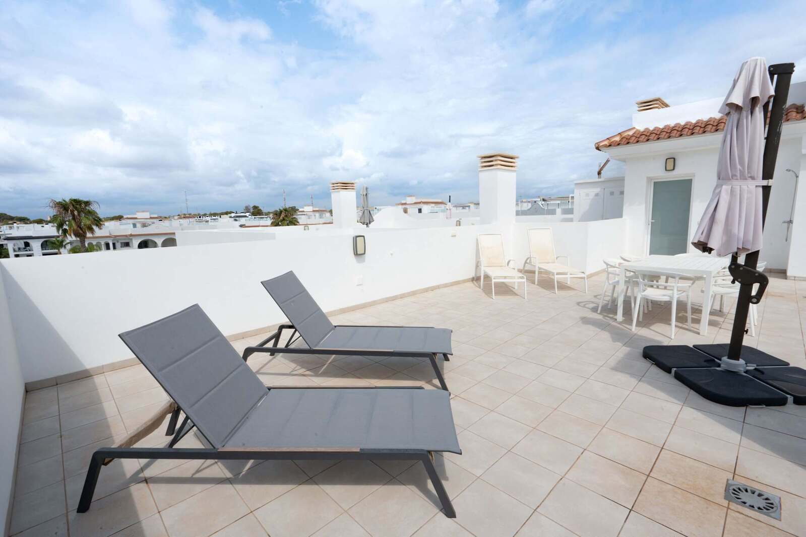 Terrace with Dining Table, Seating Area, Sun Loungers and Sun Umbrella