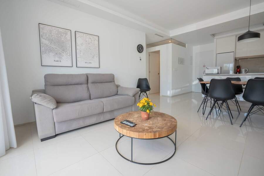 Living Room with Fully Equipped Kitchen, Dining Table, Sofa and TV