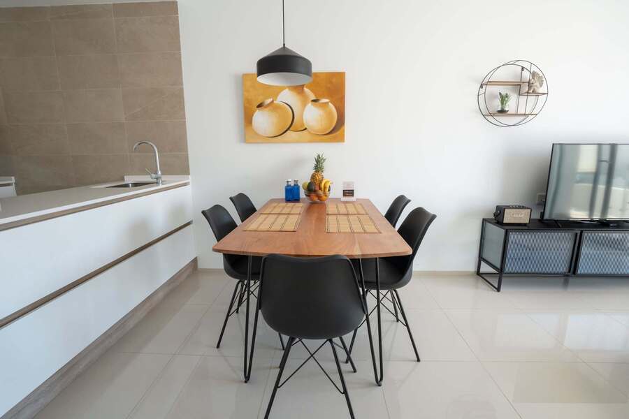 Living Room with Fully Equipped Kitchen, Dining Table, Sofa and TV