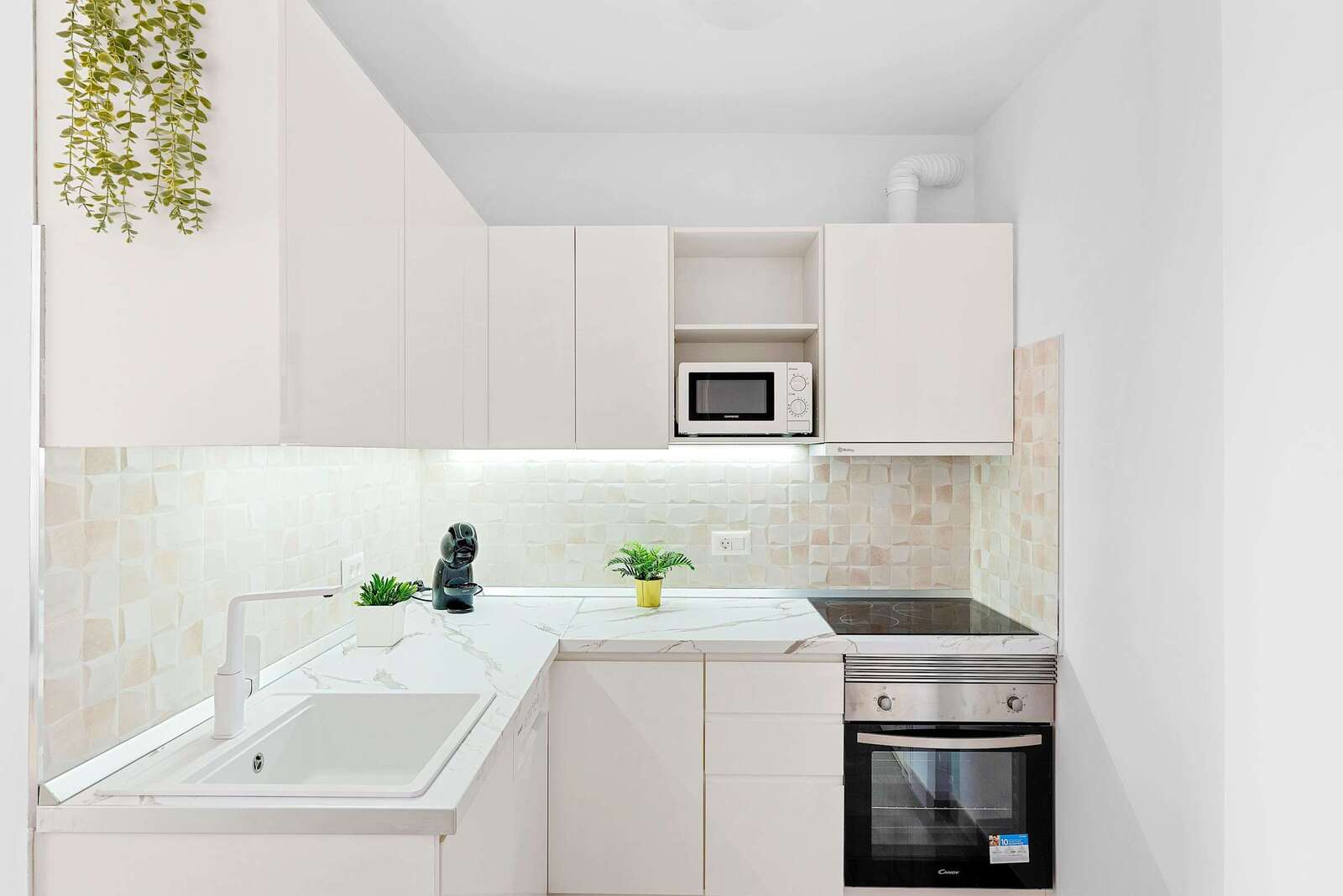 Kitchen with Dishwasher, Washing Machine, Oven, Stovetop, Fridge, Microwave, Electric Kettle and Coffee Machine