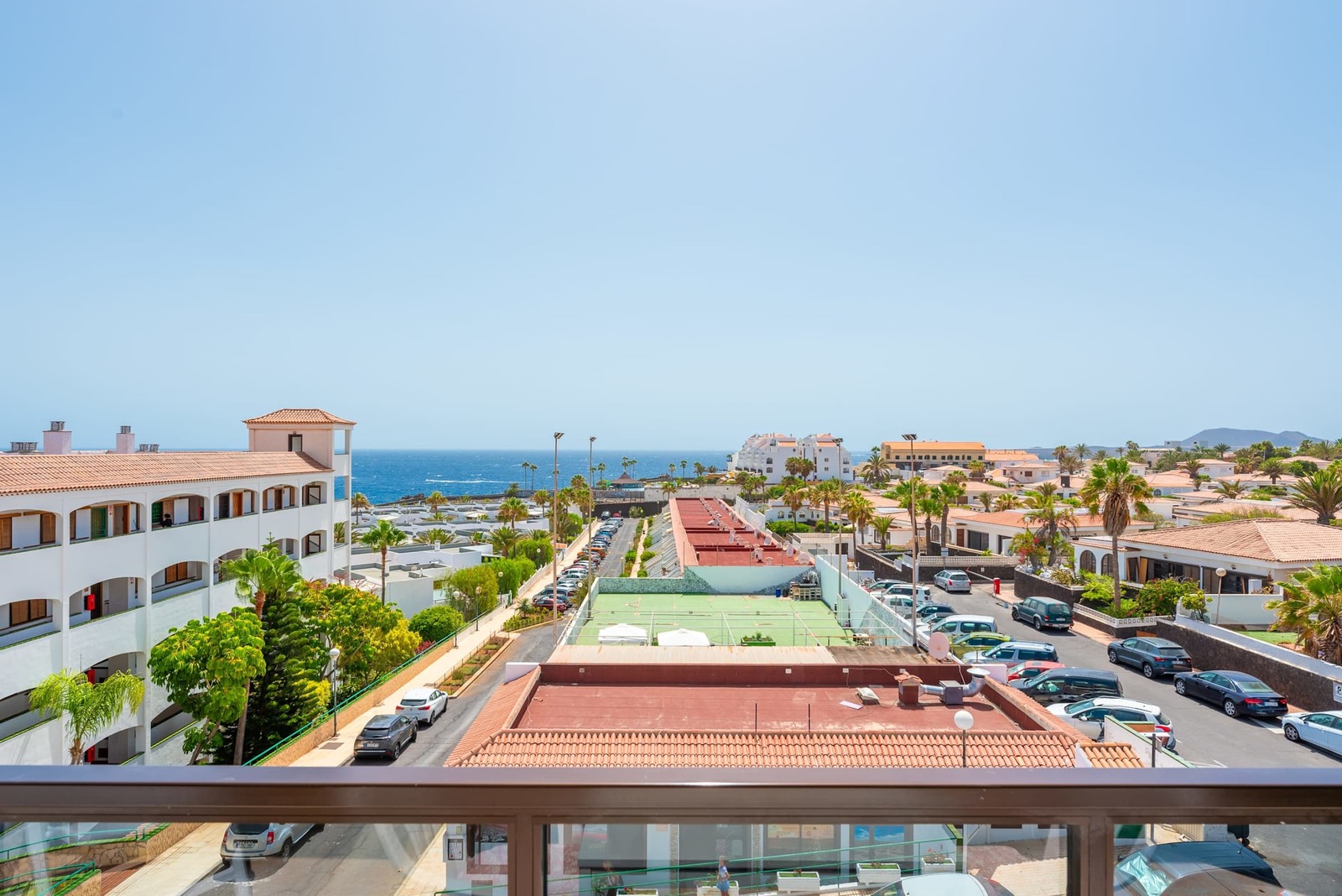 Balcony with Ocean View, Sun Loungers, Dining Table and Chairs
