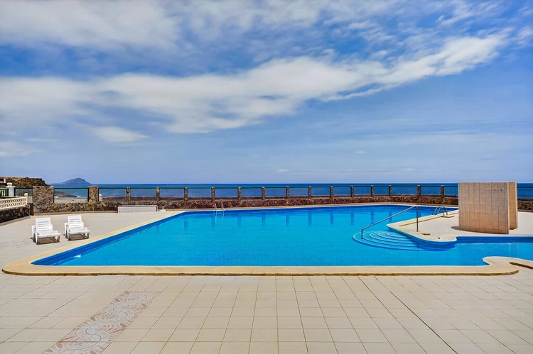 Year-Round Pool Area with Ocean Views & Sunbeds 