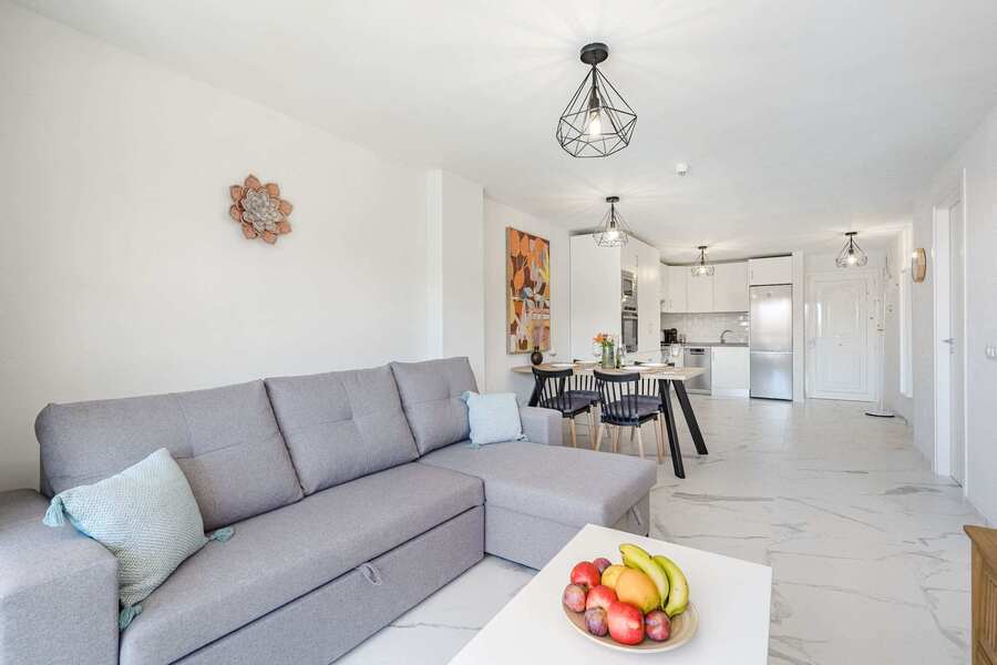 Living Room with TV, Sofa Bed, Dining Table, Coffee Table and Pool View