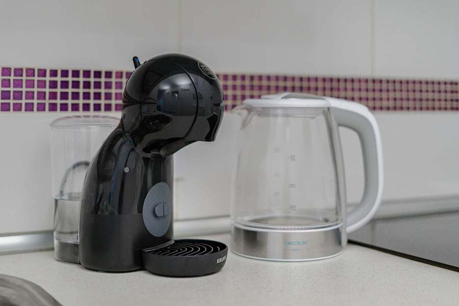 Kitchen with Coffee Maker, Toaster, Electric Kettle, Microwave, Oven, Stovetop, Dishwasher and Fridge