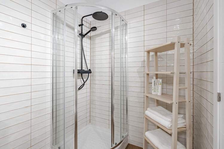 Bathroom with Shower, Sink, Toilet, Towels and Essentials
