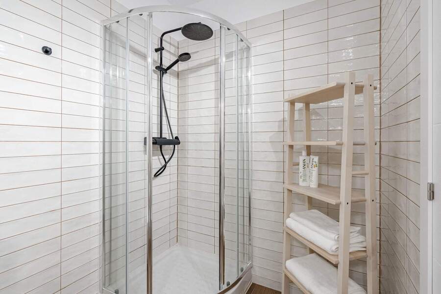 Bathroom with Shower, Sink, Toilet, Towels and Essentials