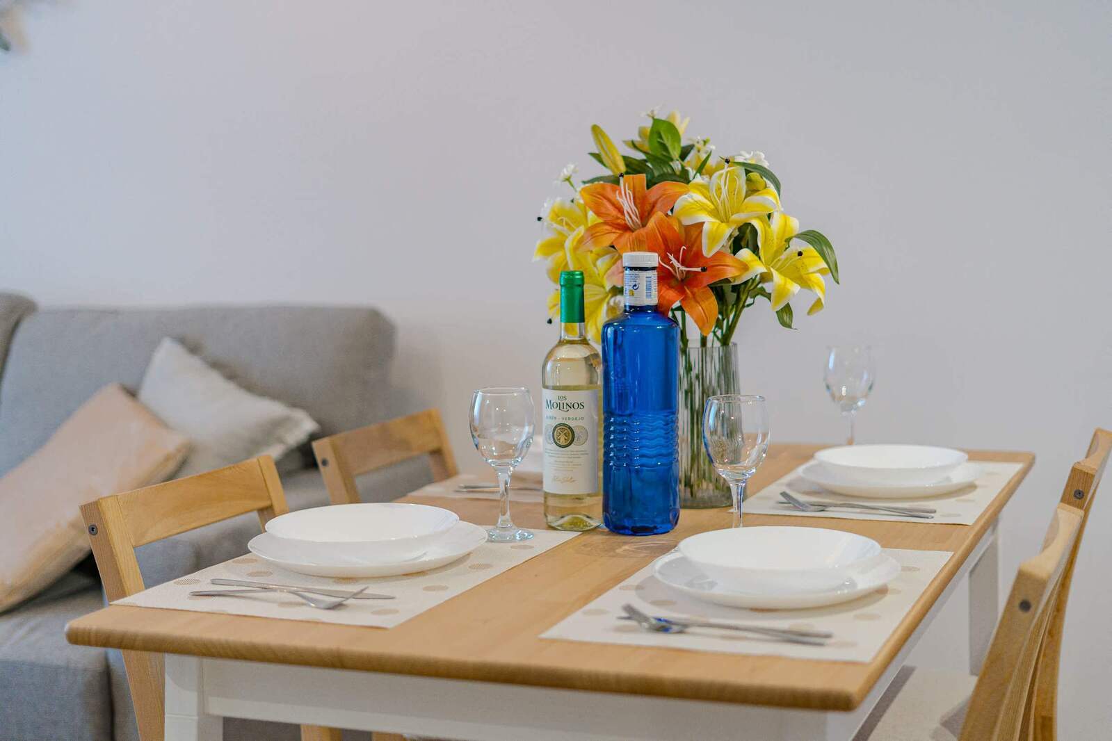 Living Room with Sofa Bed, TV, Air Conditioner, Sound System, iPad and Dining Table
