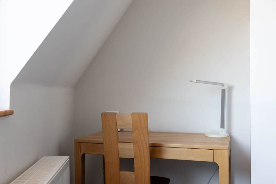 Living Area with a Dining Table, Sofa Bed, TV & Work Station