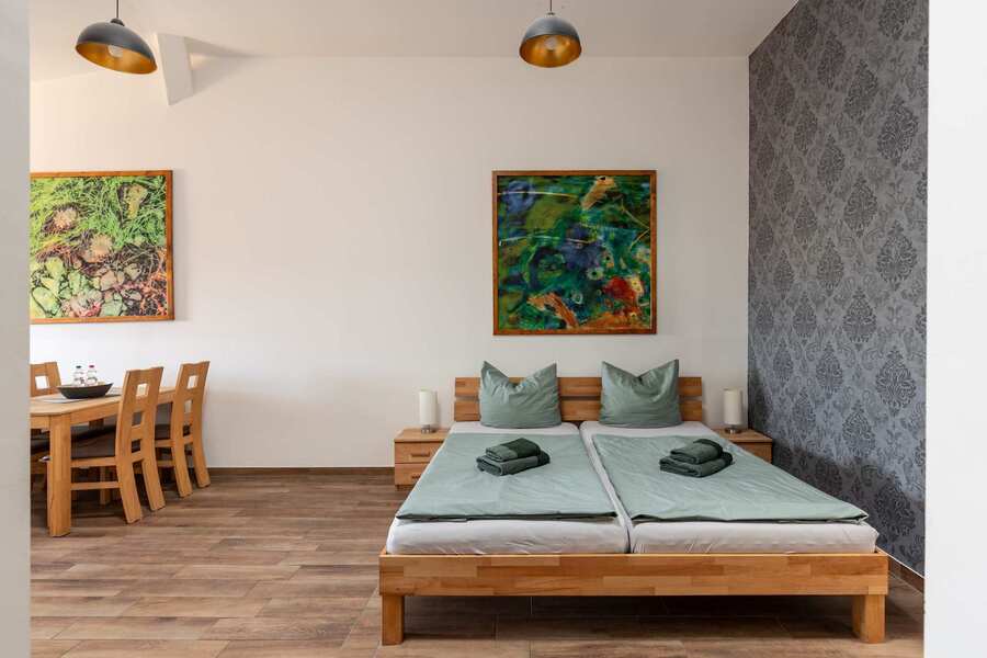 Living Area with a Double Bed, Dining Table & Sofa Bed