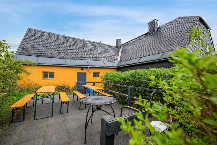 Outdoor Dining Area with picnic benches—great for meals, chats, or relaxing in the fresh air.