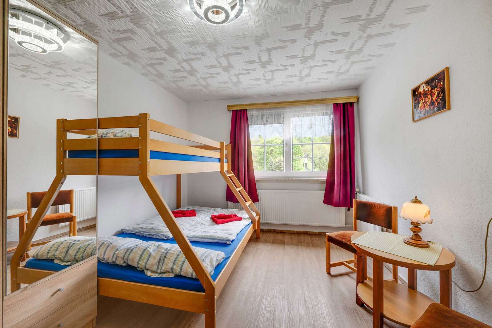 Spacious Room with sturdy Bunk Bed, Sitting Area, and Scenic Views—Ideal for both Sleep and Downtime.