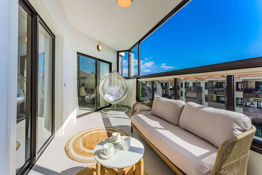 Enclosed Ocean-View Terrace with Lounge Seating & Hanging Chair — Perfect for Breezy Afternoons