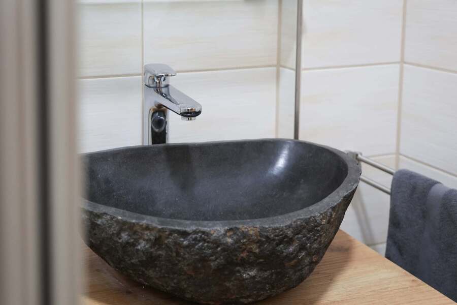 Unique Stone Basin in Modern Bathroom | Elegant Design for a Spa-Like Experience