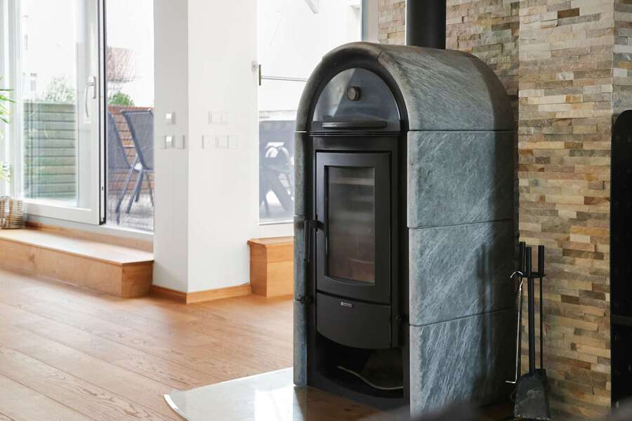 Soapstone Fireplace Detail | Cozy Scandinavian Warmth & Rustic Texture