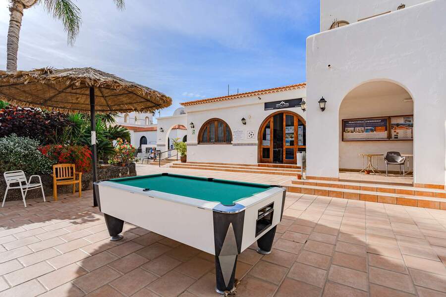 Outdoor Billiards Beneath the Palms — Chill Out with a Friendly Game in a Lush Garden Courtyard Setting