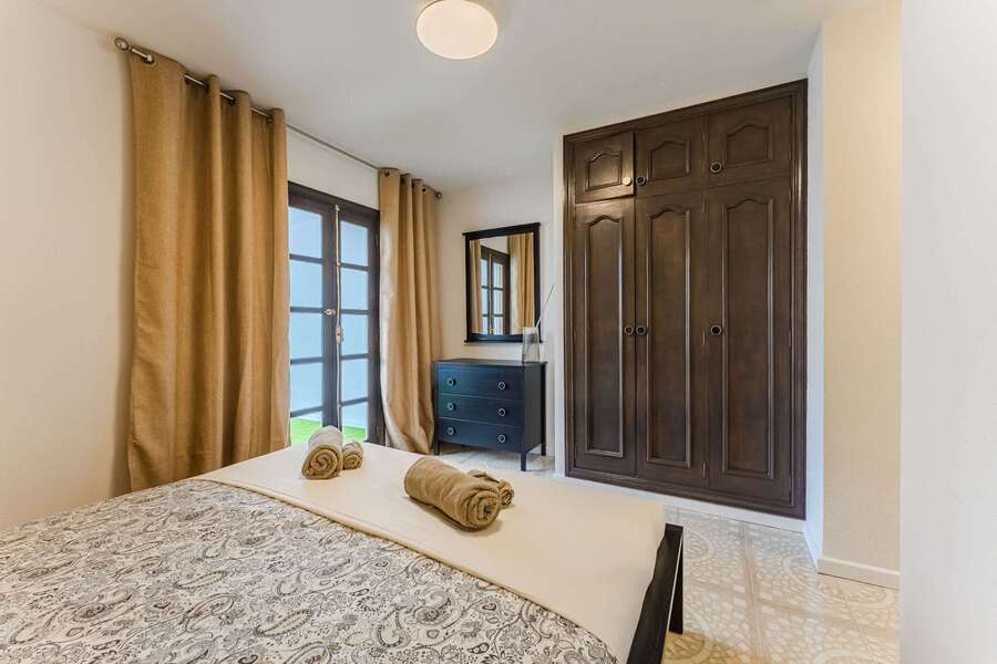 Spacious Storage & Classic Touches — Master Bedroom Features French Doors to Terrace, Ample Wardrobe Space, and a Peaceful Vibe