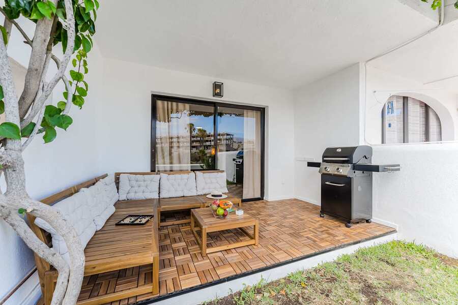 Shaded Garden Terrace with Comfy Lounge — A Breezy Spot to Enjoy Fruit, Play Games, or Unwind Surrounded by Nature