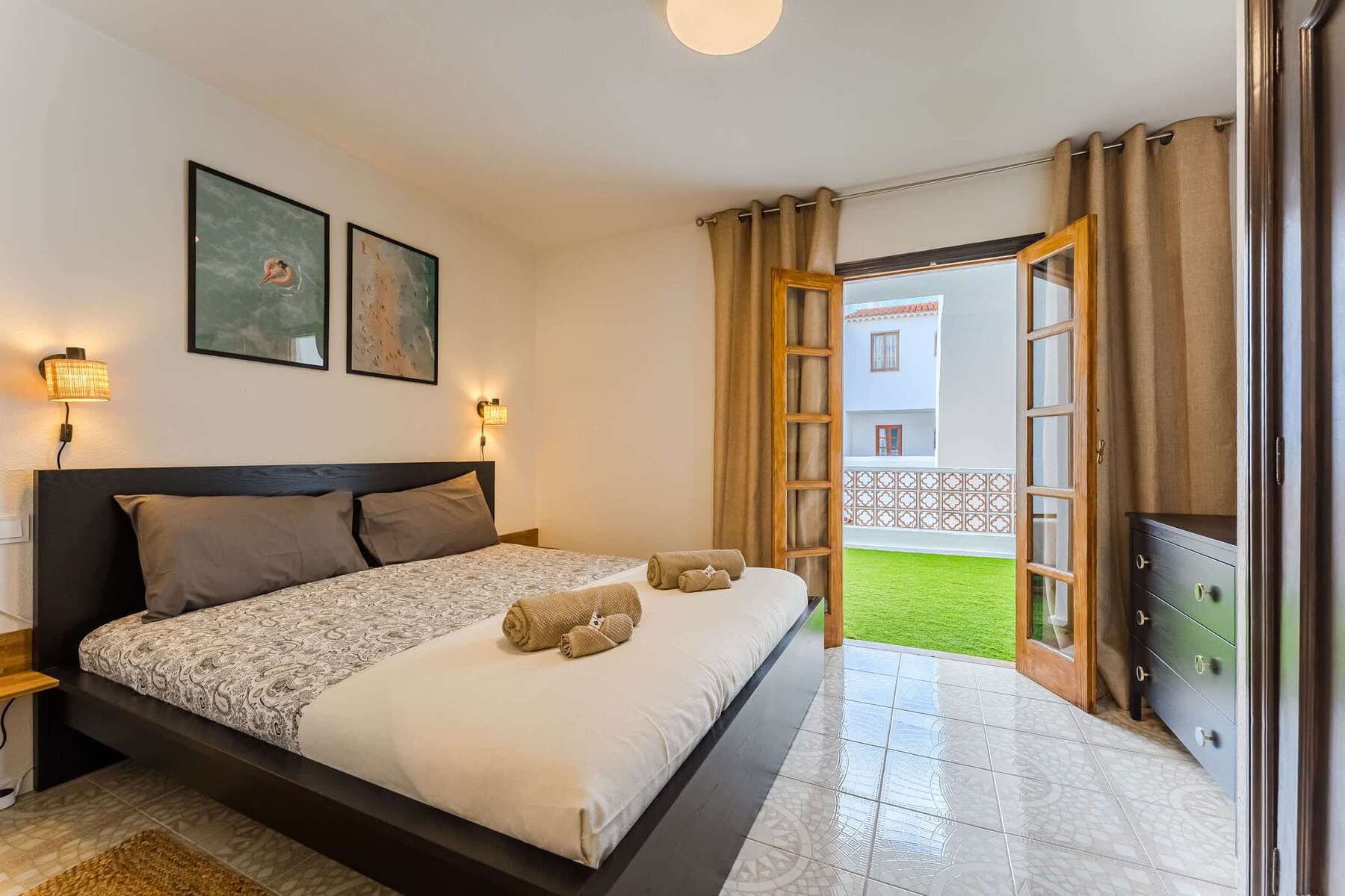 Master Bedroom with Views — Wake Up to Natural Light & Step Straight Out to a Private Green Space Through French Doors
