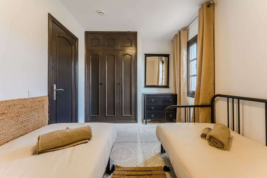 Second Bedroom Storage & Style — Full-Length Wardrobe, Natural Light & Earthy Decor Make This Room Practical and Peaceful