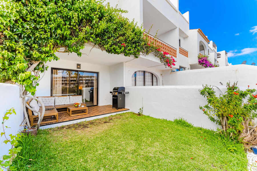 Garden Oasis with Cozy Lounge Under the Vines — Perfect for Sun-Kissed Afternoons or a Relaxing Glass of Wine in the Shade