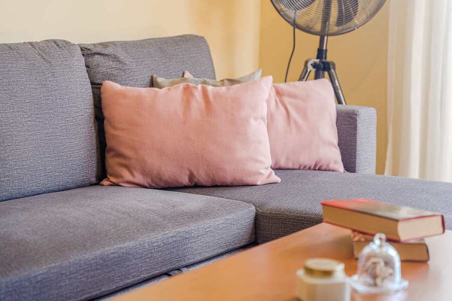 Cushioned Comfort – Lounge Area with Soft Textures & Sunset Ambience