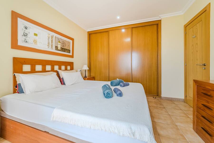 Restful Nights Await – Spacious Bedroom with Ample Storage & Soothing Ambience