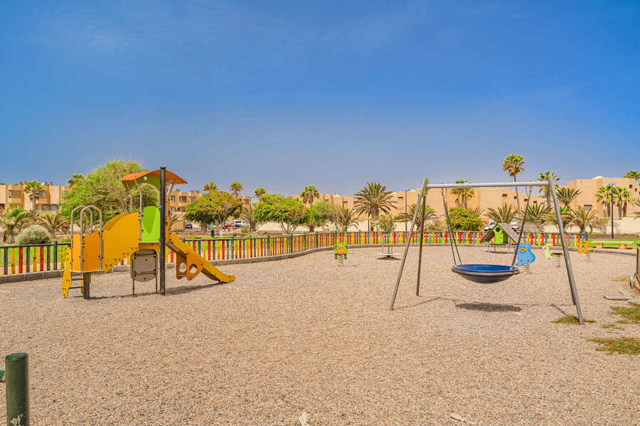 Family Playtime by the Sea – Colourful Playground Moments in the Sun