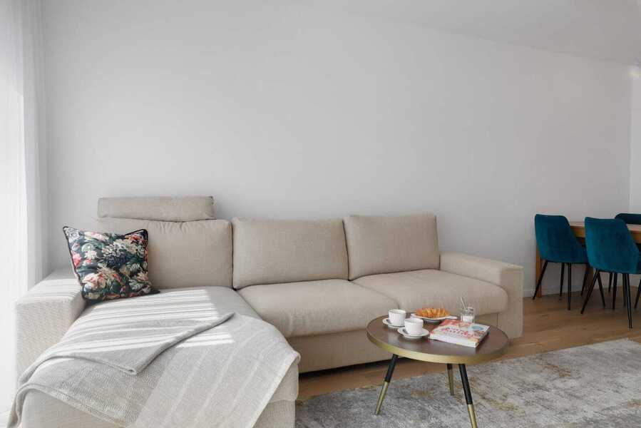 Modern Comfort Meets Design — Inviting Sofa Setup Next to Dining, Ideal for Cozy Nights or Gatherings