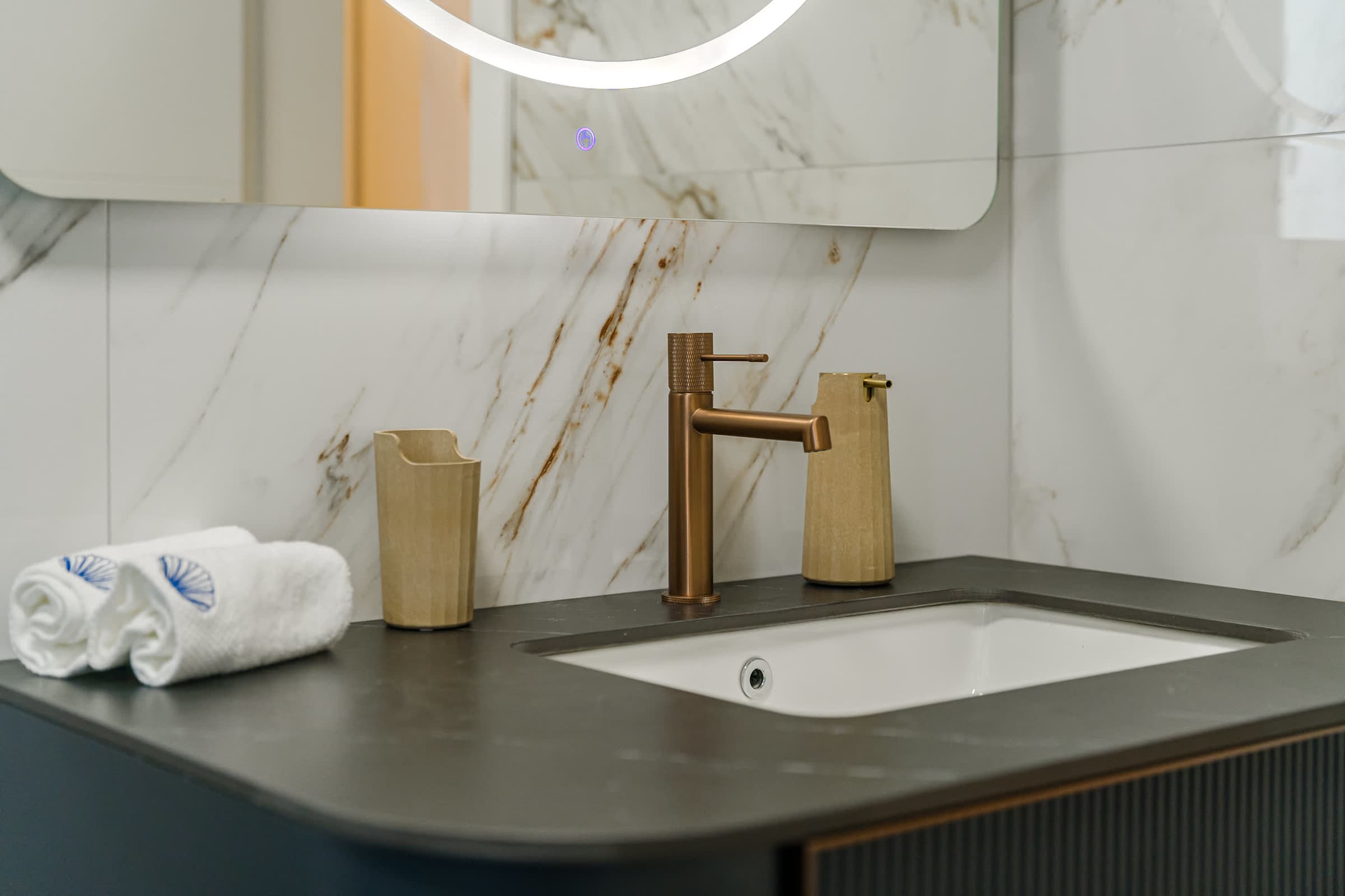 Elegant Bathroom Detail – Golden Accents & Marble Touches for a Spa-Like Feel