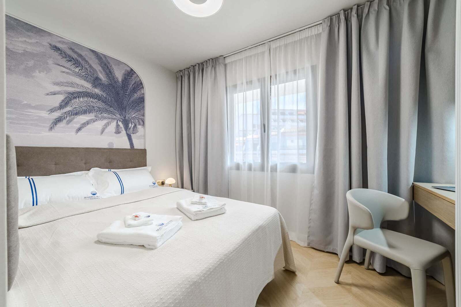 Stylish Bedroom with Palm-Inspired Accent Wall – Wake Up in Coastal Elegance