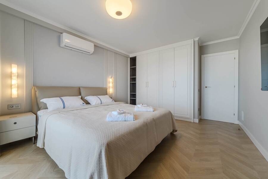 Spacious & Bright Bedroom – Soft Lighting, Cozy Bedding, and Stylish Modern Design