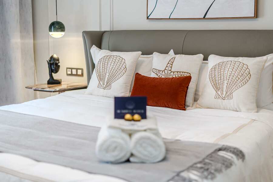 Artfully Curated Master Suite with King Bed — Sleep Under Elegant Lighting in a Space Designed for Serenity and Sophistication