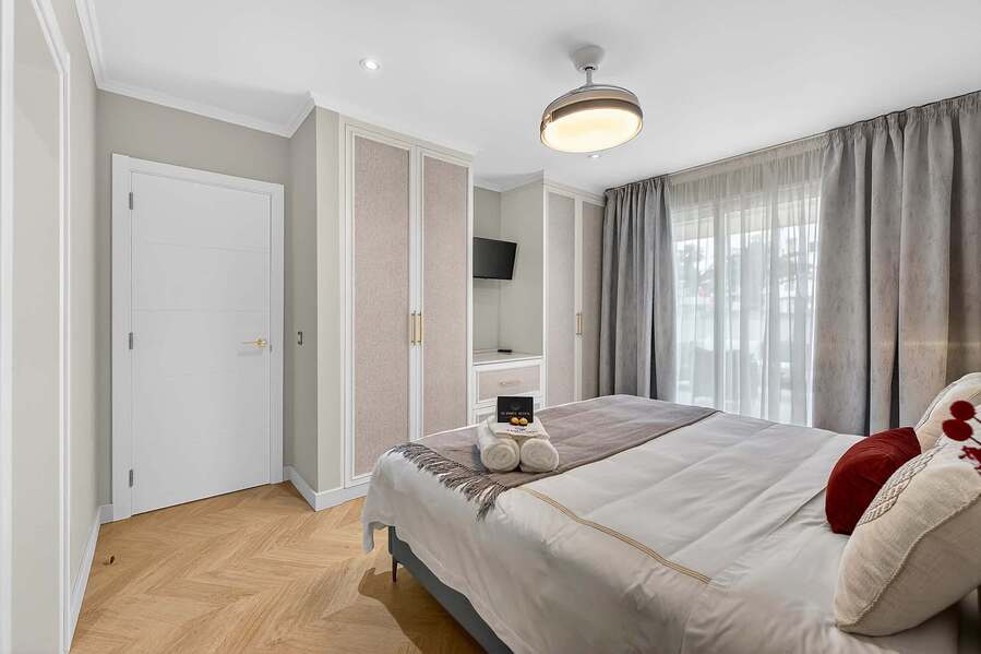 Artfully Curated Master Suite with King Bed — Sleep Under Elegant Lighting in a Space Designed for Serenity and Sophistication