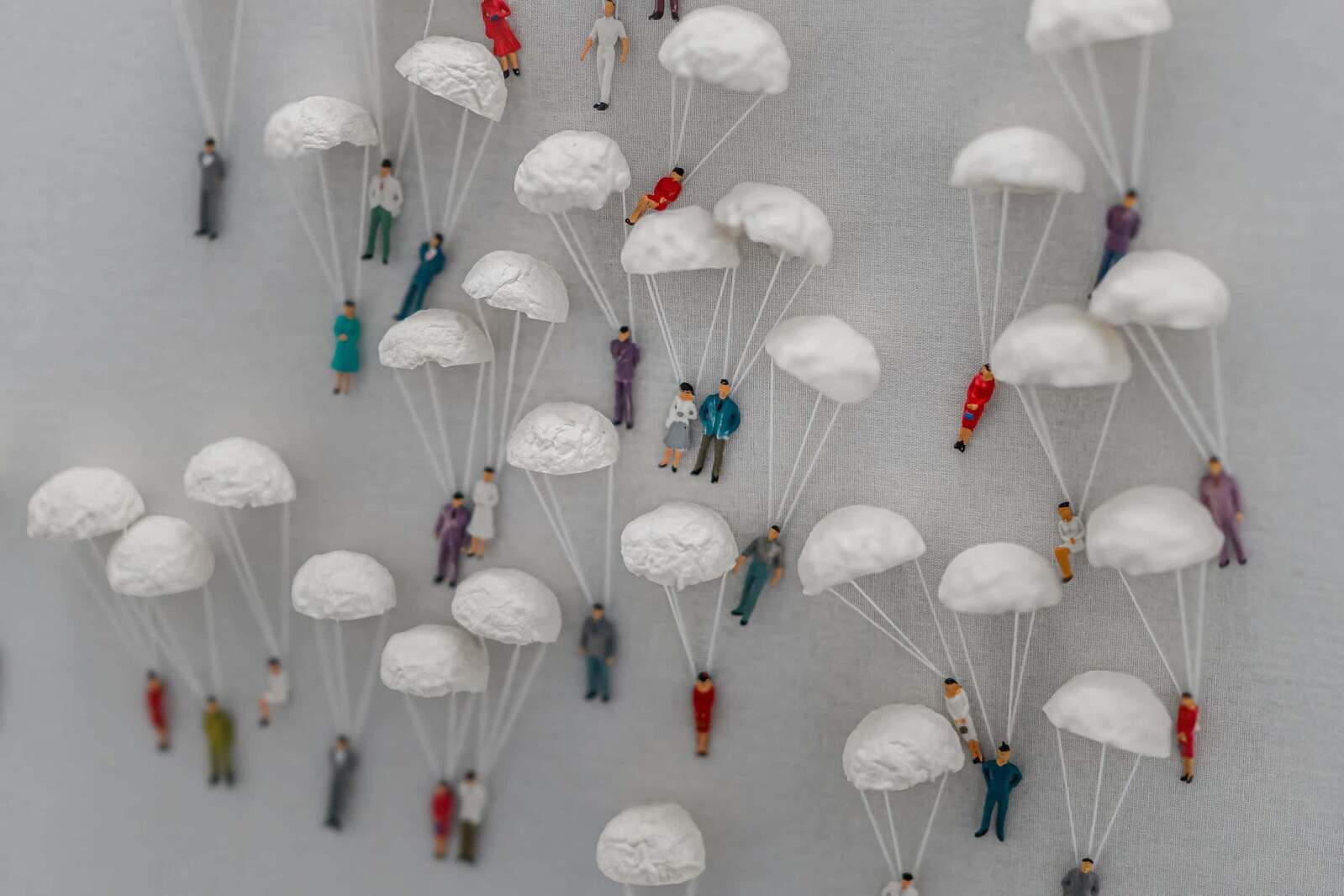 Miniature Figurines With Delicate Seashell Parachutes — A Touch of Coastal Whimsy