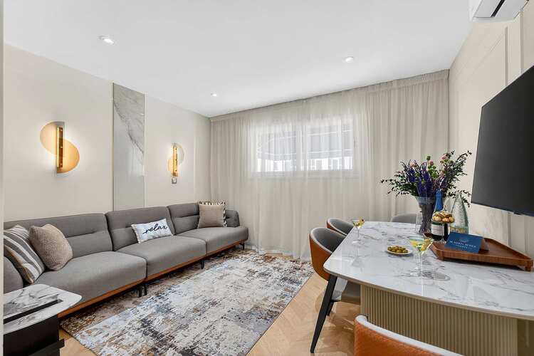 Elegant Open-Concept Living and Dining Area — Relax in Contemporary Comfort with a Designer Sofa, Smart TV and Ocean Breeze Ambience