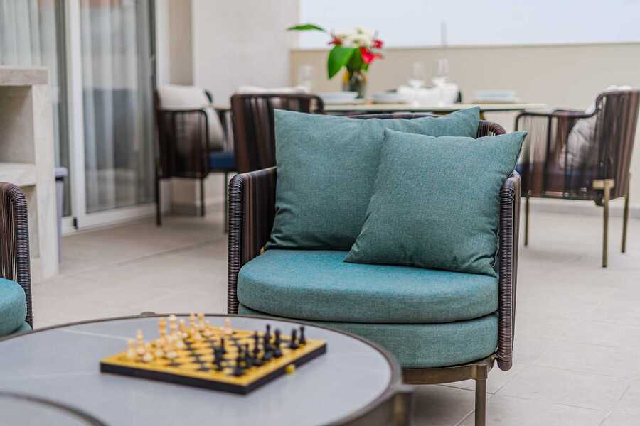 
Designer Outdoor Lounge with Dining & Daybeds — Entertain in Style on Your Private Sun-Drenched Terrace in SeaShell Suites
