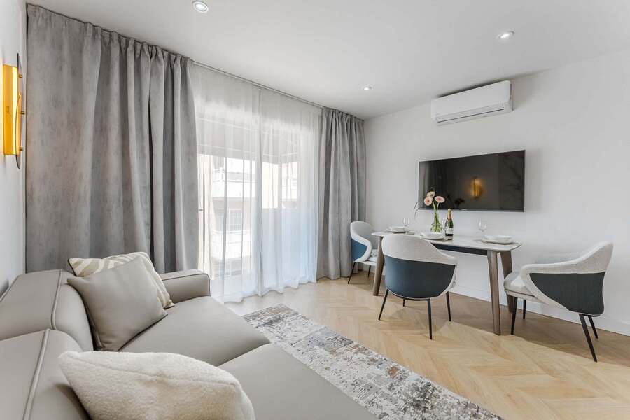 Elegant Living Room with Designer Sofa, Chic Lighting & Access to Private Slimline Balcony