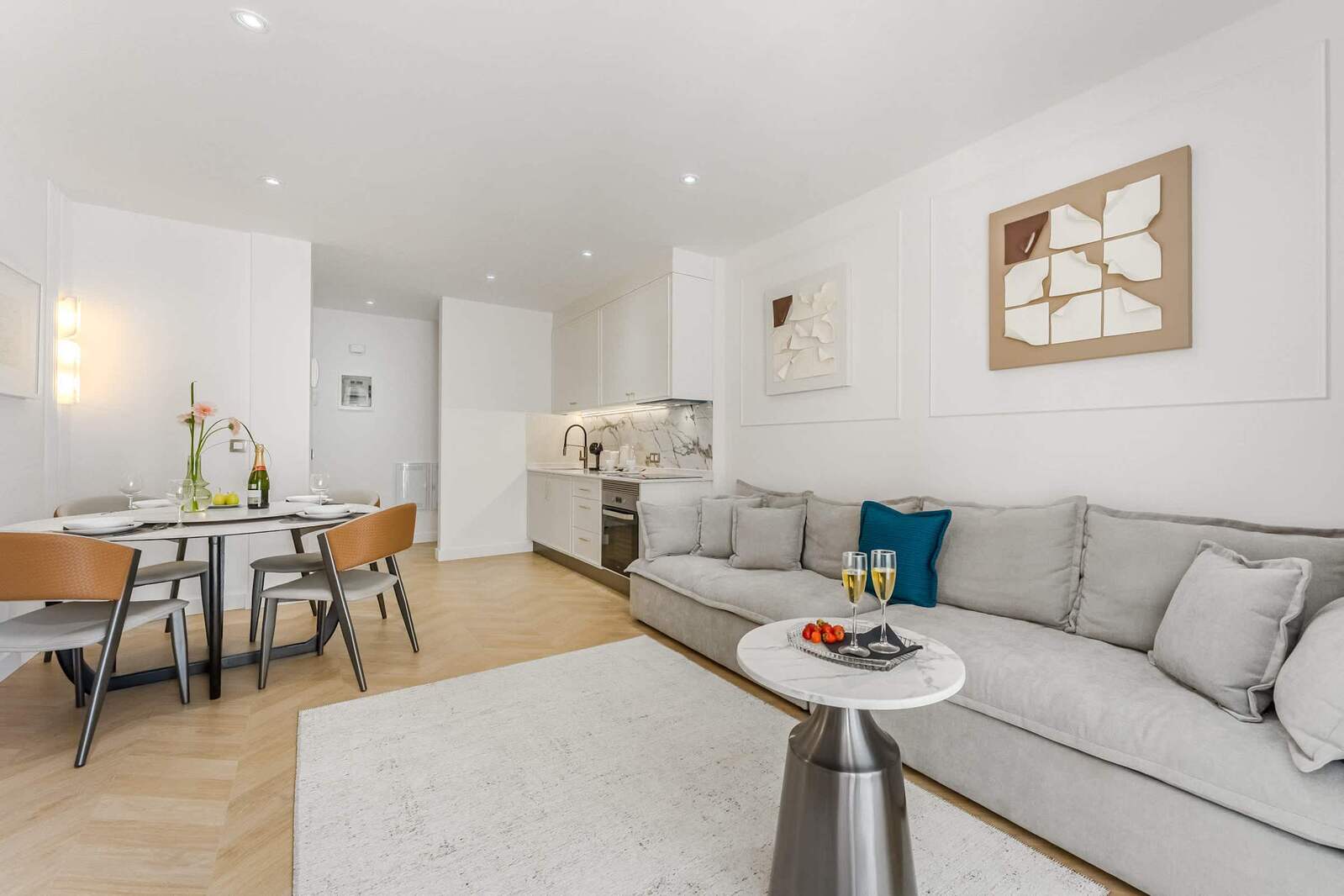 Bright Open Living Area – Sip Bubbly and Share Moments in a Soft, Curated Space with Artistic Touches