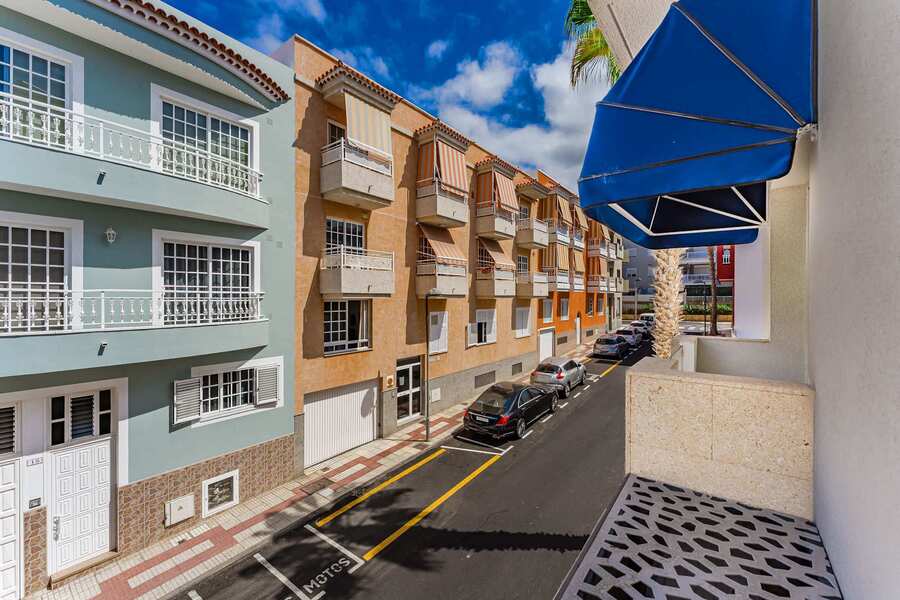 Balcony View Over Quiet San Juan Street With Local Charm and Vibrant Colours