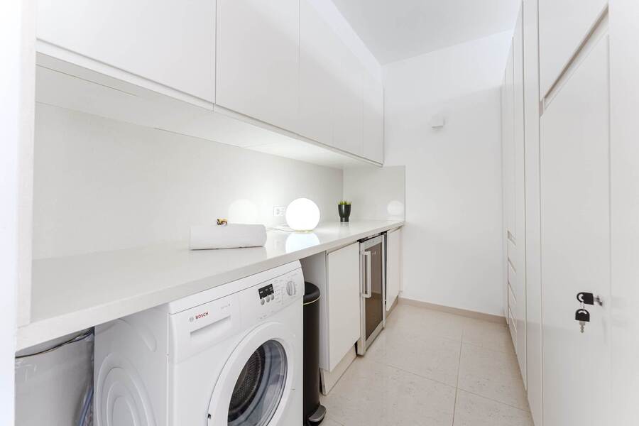 Dedicated Laundry Area with Washer, Wine Fridge, Ample Storage, and LED Mood Lighting