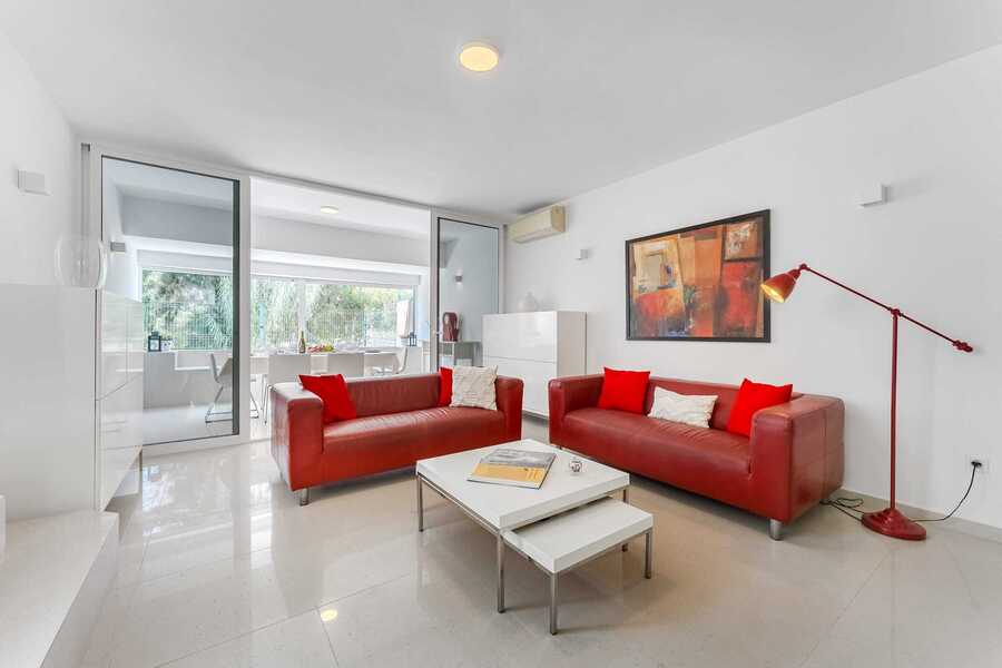 Modern Open Living Room with Glass Sliding Doors, Artful Touches and Garden Views