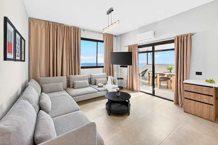 Spacious Living Area with Ocean View, AC, Multimedia TV & Sonos Sound System, Dedicated Working Space & Direct Exit to the Private Roof-Top Terrace