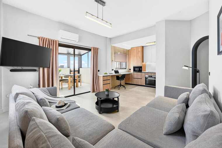 Spacious Living Area with Ocean View, AC, Multimedia TV & Sonos Sound System, Dedicated Working Space & Direct Exit to the Private Roof-Top Terrace